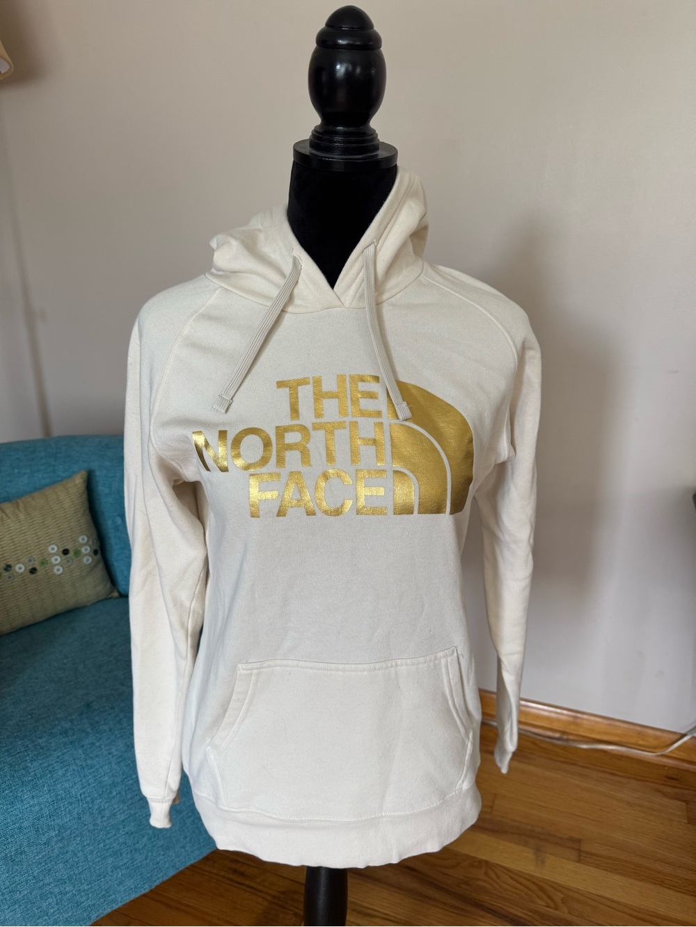 The North Face Cream Pullover Hoodie with Gold Logo